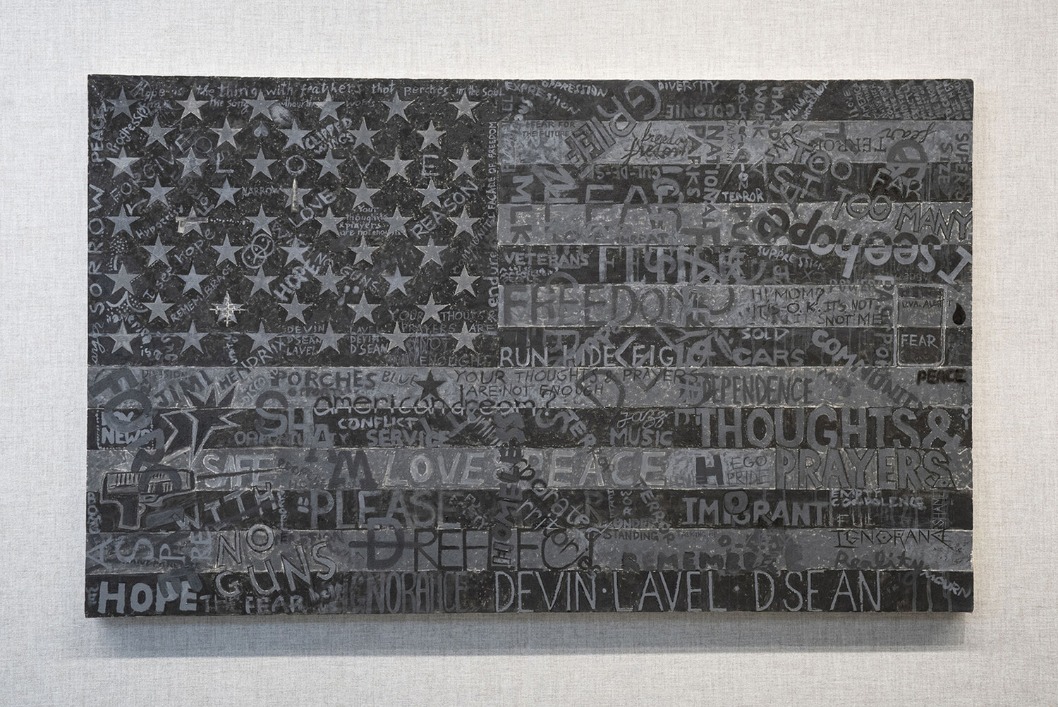 Professor Sanda Iliescu and 100 volunteers painted Dark Flag (2023, acrylic on canvas, with embroidery thread, 3' x 5') as a meditation on the tragedy of gun violence in America. Photo: Dan Addison, University Communications.