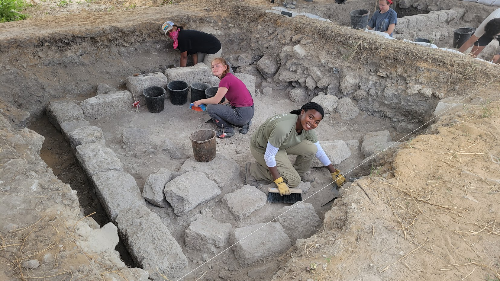 UVA Archaeology majors Abigail Sarpong (&apos;25), Elliot Alvey (&apos;24), and Ashley Prillerman (&apos;24) dig in the Bosnian settlement.