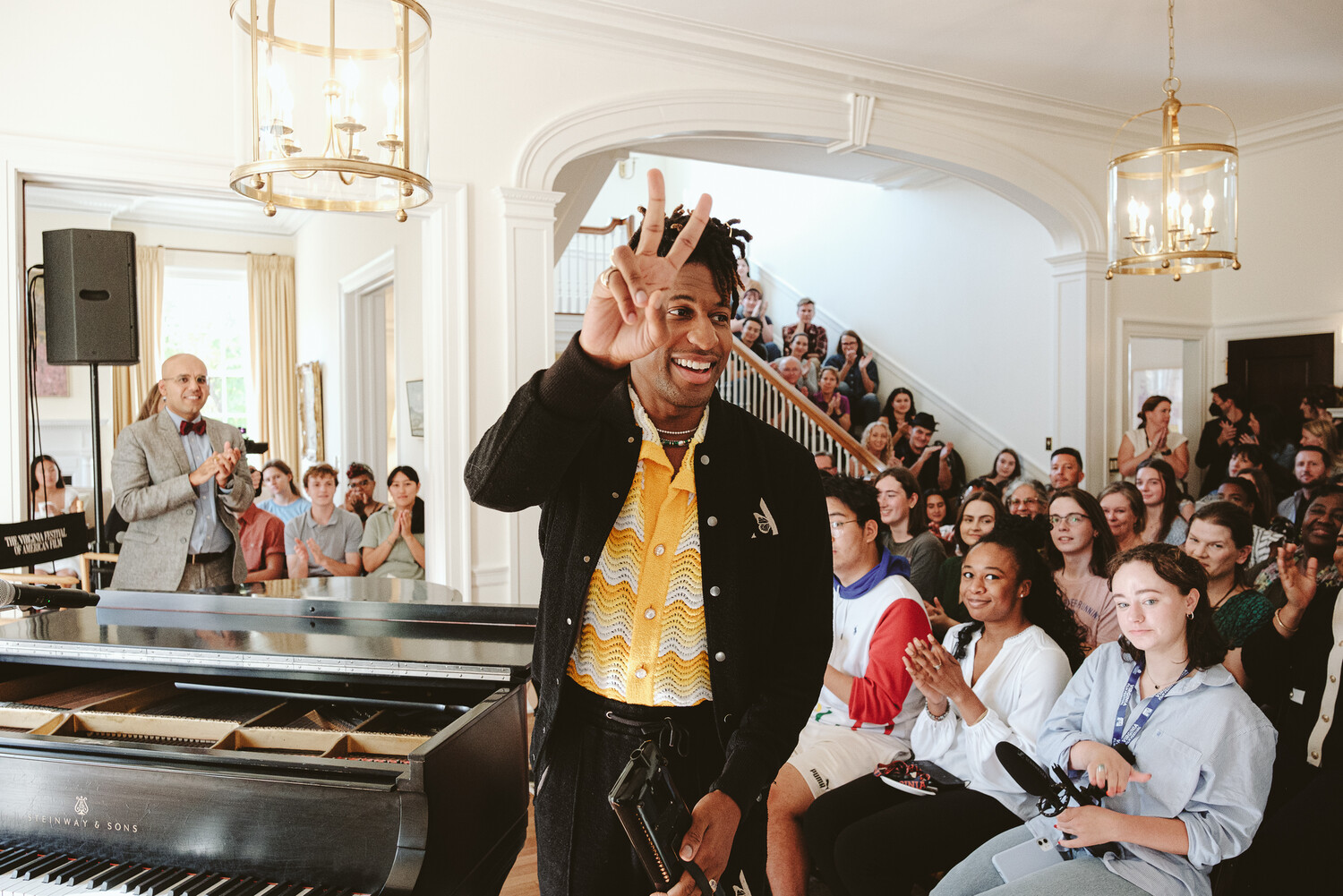 Jon Batiste at Arts on the Hill with audience behind him