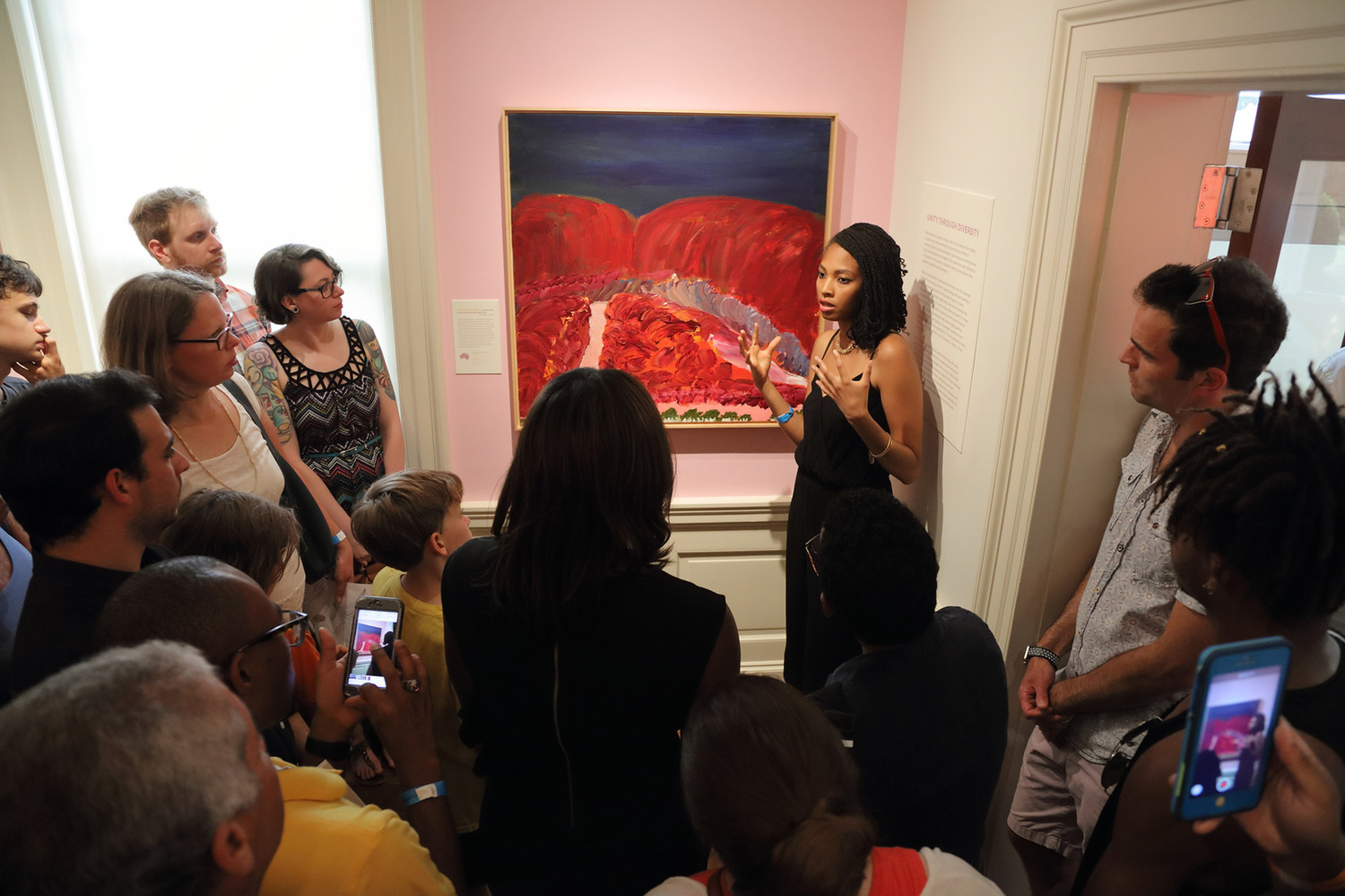 Imani Williford gives a gallery talk during the opening night of Songs of a Secret Country.