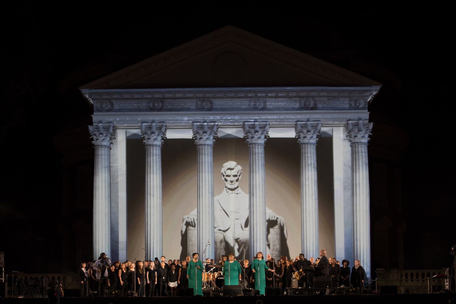 The Ingramettes in front of the a projection mapped to show the Lincoln Memorial.