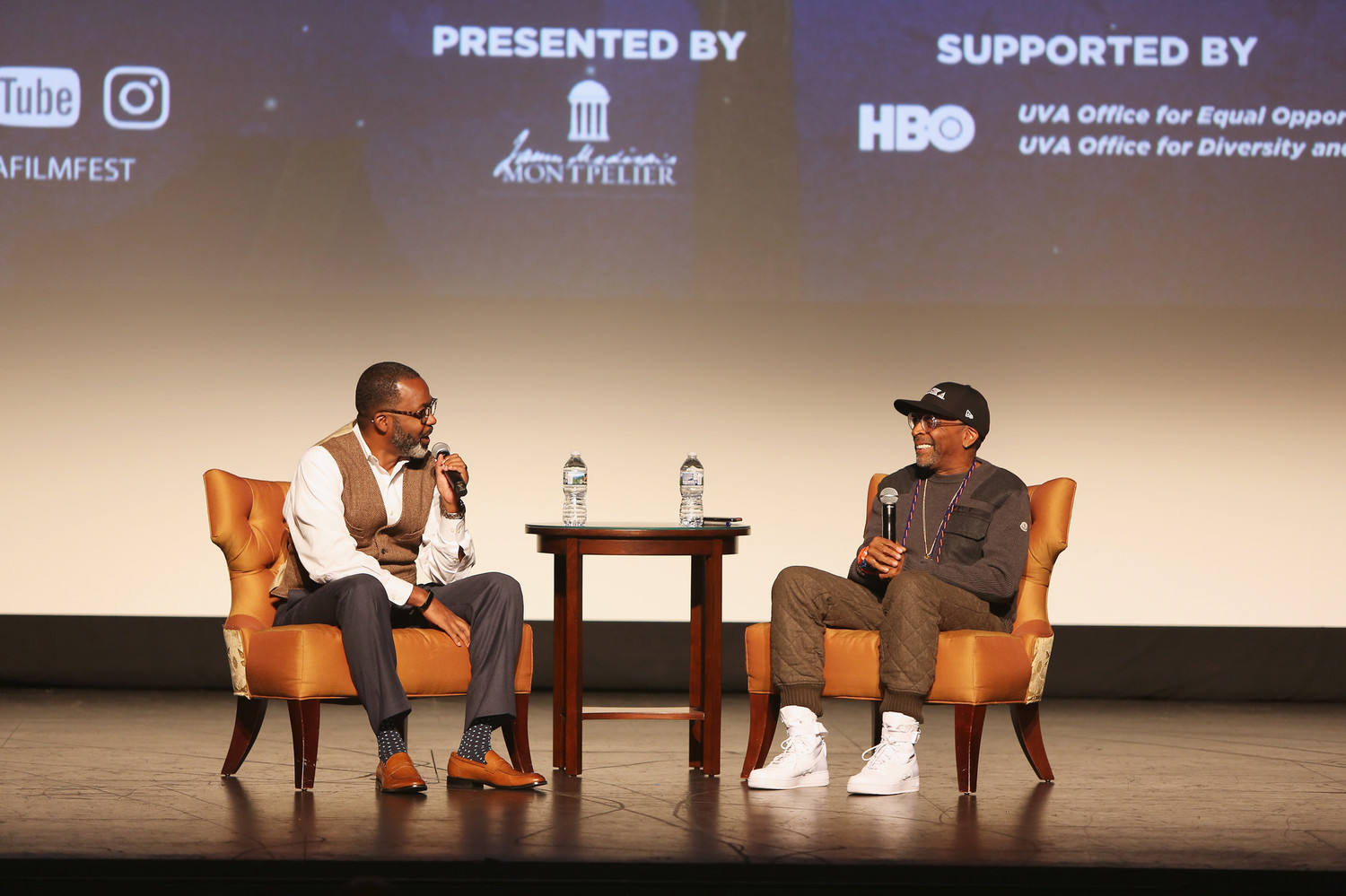 Moderator Maurice Wallace and director Spike Lee speak onstage at the 4 Little Girls screening and Q&A at Paramount Theater during the 30th Annual Virginia Film Festival