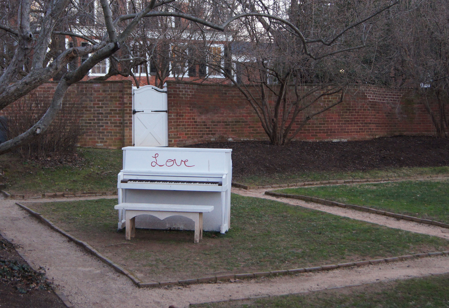 White piano in UVA garden inscribe with the word, Love
