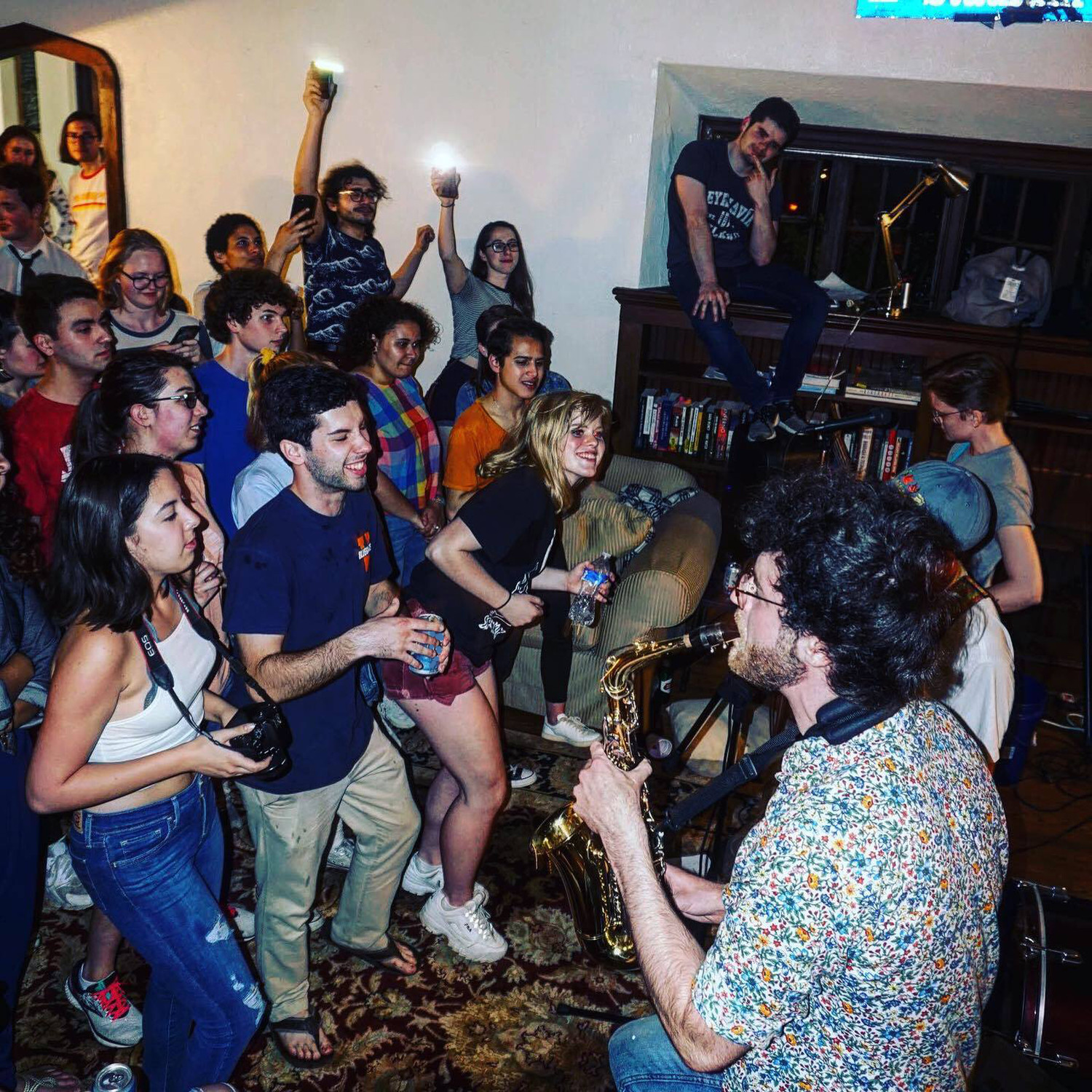 Musicians playing at a University Records House Show