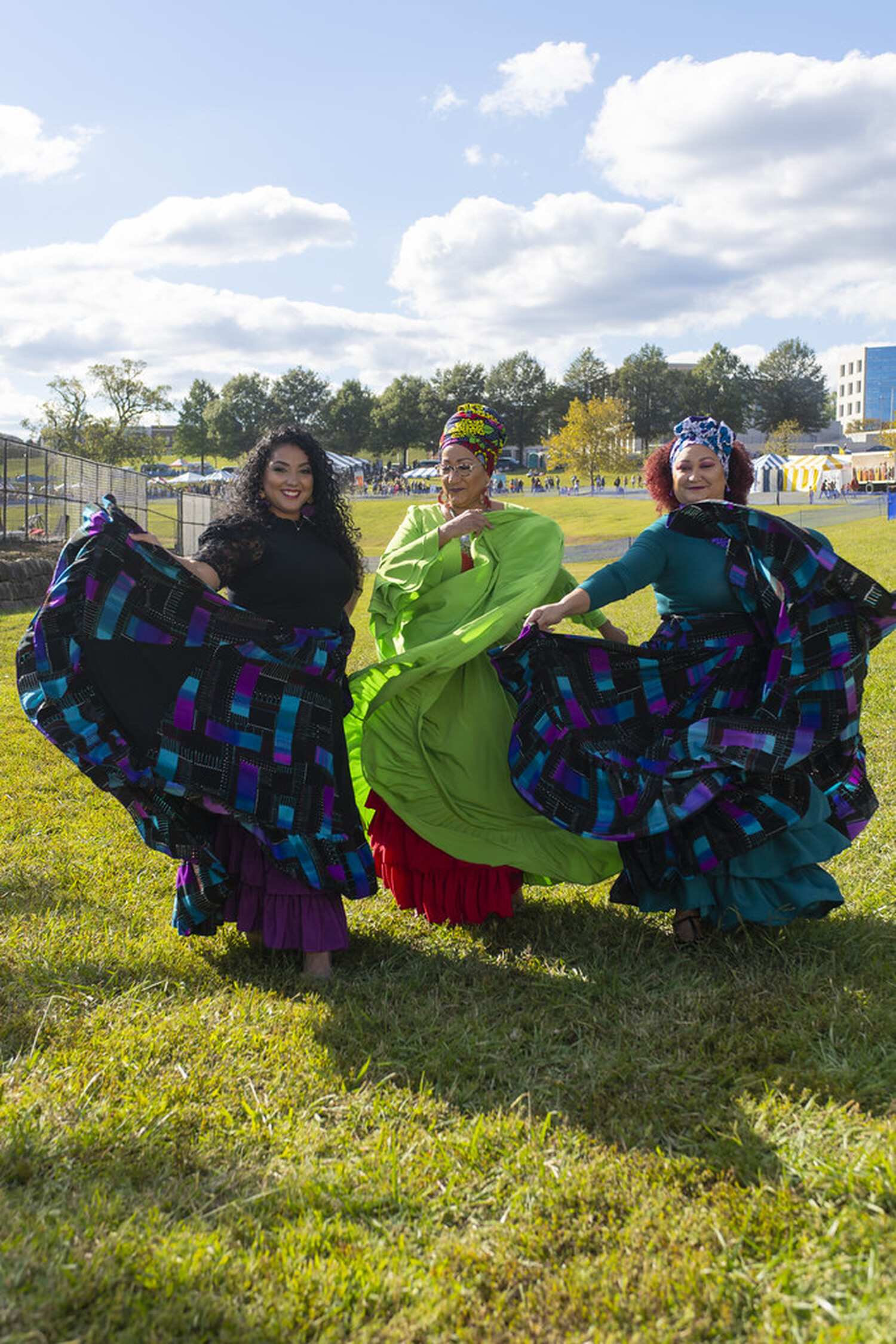 Tata, center, photographed with her daughters before the Bomba Showcase at the Richmond Folk Festival 2022. Pat Jarrett/Virginia Humanities